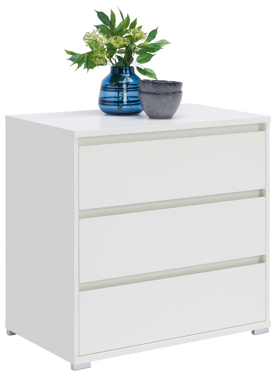 Weiße Kommode mit drei Schubladen, dekoriert mit einer blauen Vase und einer grauen Schale, seitliche Perspektive