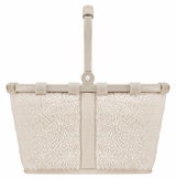 Kleiner, cremefarbener Korb mit weichem, flauschigem Stoff und stabilem Griff, frontal abgebildet.