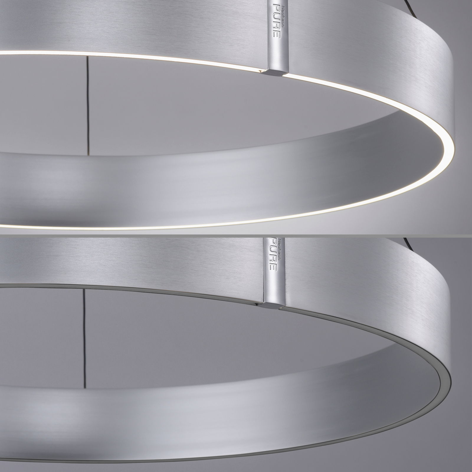 Moderne, runde Pendelleuchte aus gebürstetem Metall mit seitlicher Perspektive, die das minimalistische Design und die gleichmäßige Lichtverteilung zeigt.