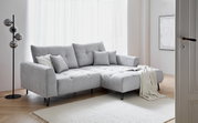 Graues Ecksofa SWING mit Ottomane, dekoriert mit Kissen und Decke, in einem hellen Wohnzimmer, seitliche Perspektive.