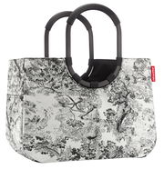 Schwarze und weiße Einkaufstasche mit floralem Muster und zwei großen, runden Griffen, seitliche Perspektive