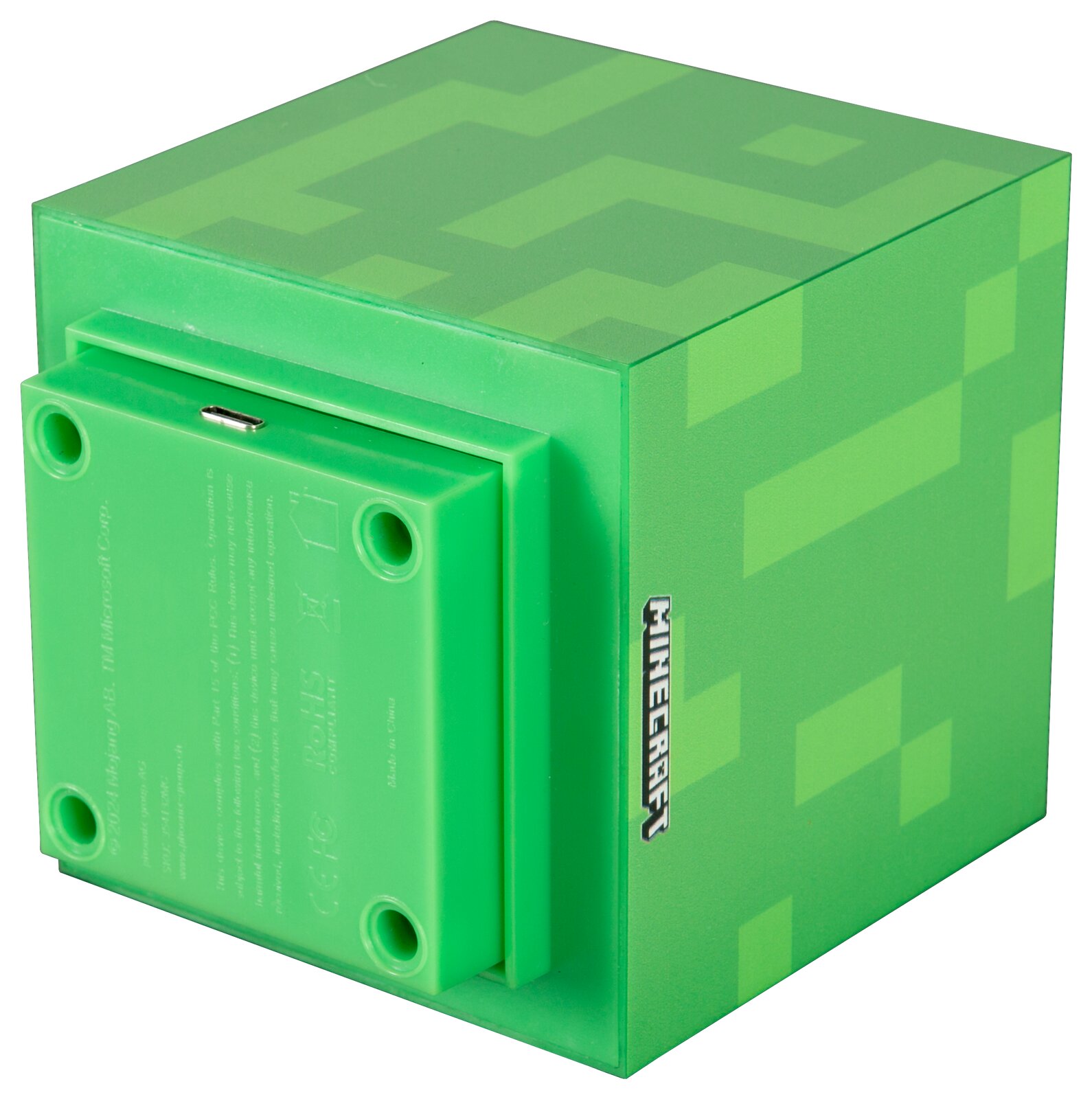Grüner, würfelförmiger Minecraft-Block mit Pixelmuster und seitlichem „MINECRAFT“-Logo, Rückansicht in schräger Perspektive mit sichtbarer Unterseite und Micro-USB-Anschluss.