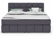Frontale Ansicht eines modernen Boxspringbetts mit grauem Stoffbezug und zwei Kissen.