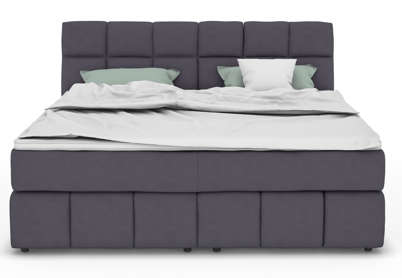 Vooraanzicht van een modern boxspringbed met een grijze stoffen bekleding en twee kussens.