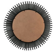 Rückansicht eines runden Spiegels mit einem dekorativen schwarzen Rahmen in Sonnenstrahlen-Design.