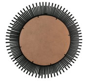 Rückansicht eines runden Spiegels mit einem dekorativen schwarzen Rahmen in Sonnenstrahlen-Design.